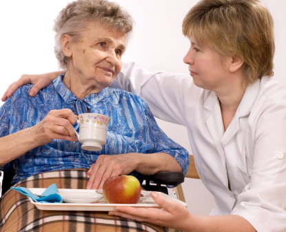 caregiver taking care of an elderly person